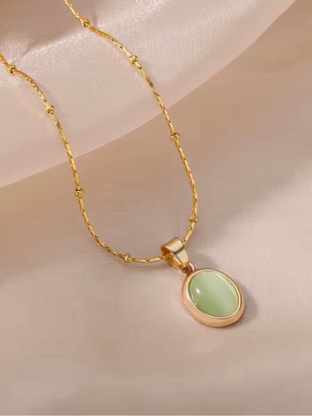 Gold Oval Pendant Necklace with Green Stone